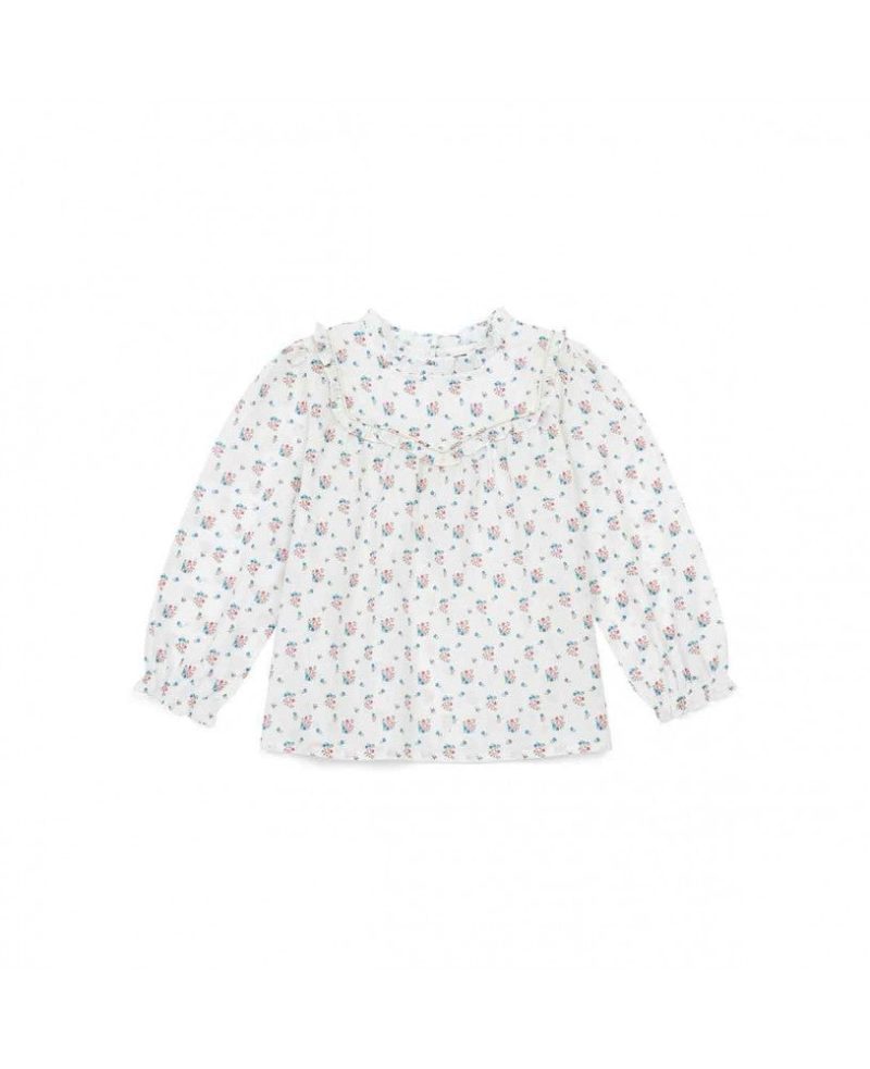 blusa padrão fundo branco com pequenas flores em azul e rosa